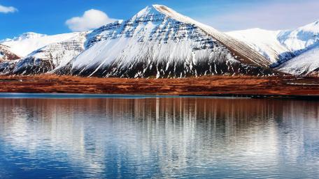 Majestic Snow-Capped Mountains by Tranquil Waters wallpaper