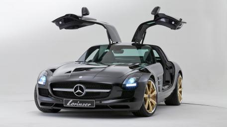 Sleek Black Mercedes with Gold Accents and Iconic Doors wallpaper