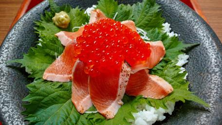 Delicious Salmon Sashimi with Fish Roe and Greens wallpaper