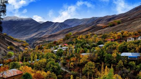 Autumn Embrace in a Mountain Village wallpaper