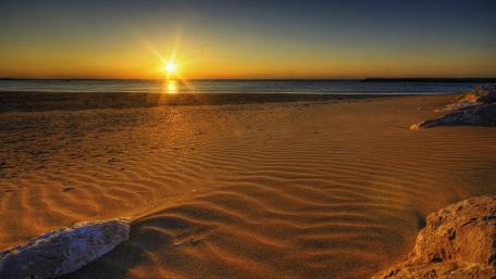 Golden Sunset Over Serene Beach Landscape wallpaper