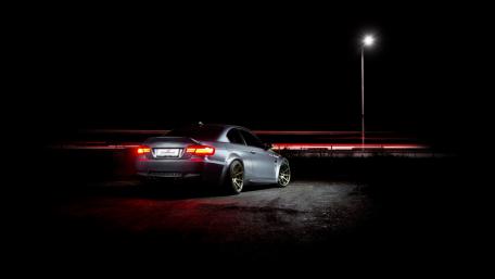 Sleek Car Under Night Lights wallpaper