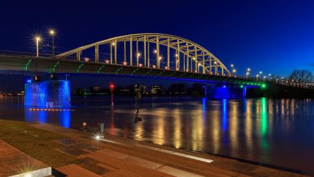 City Bridge Illuminated at Night Over Water wallpaper