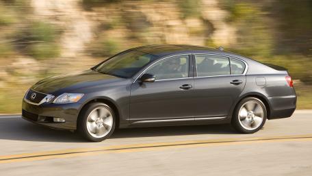 Sleek Luxury Sedan on the Open Road wallpaper