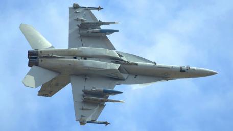 Powerful Jet in Action Above the Clouds wallpaper