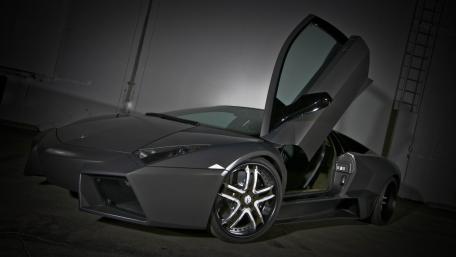 Sleek Black Supercar with Futuristic Design wallpaper