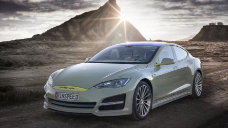 Sleek Electric Car Against Majestic Landscape wallpaper