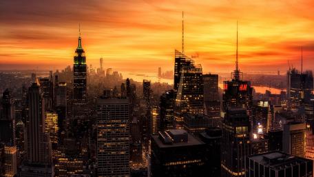 Majestic Skyline at Sunset Over Urban Landscape wallpaper