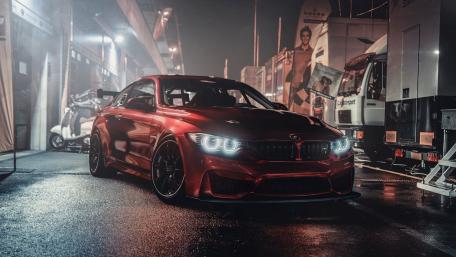 Sleek Red BMW in Urban Nightscape wallpaper