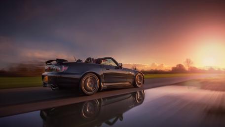 Sleek Convertible at Sunset Moment wallpaper