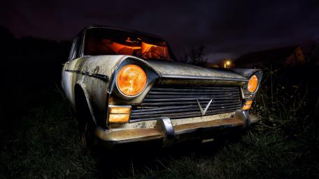 Rustic Charm of an Abandoned Classic Car wallpaper