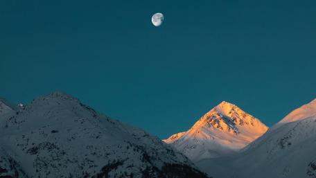 Majestic Mountains Under a Glowing Moonlight wallpaper