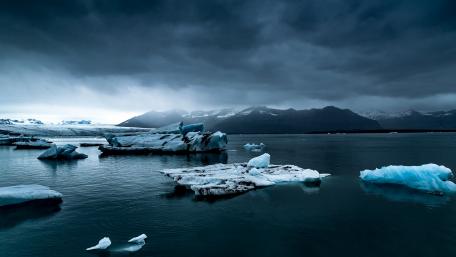 Majestic Icebergs in a Darkened Landscape wallpaper