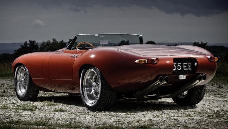 Sleek Modern Convertible in Rustic Setting wallpaper