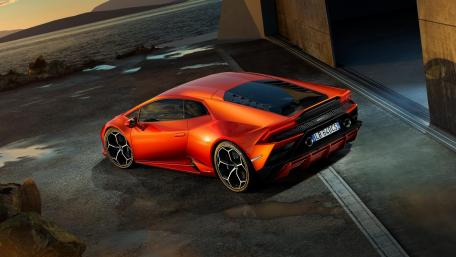 Sleek and Striking Orange Sports Car Wallpaper wallpaper