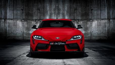 Dynamic Red Toyota Supra Wallpaper for Car Enthusiasts wallpaper