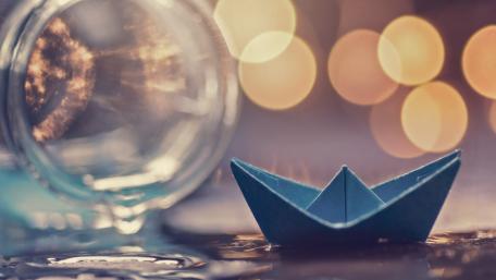 Paper Boat Serenity with Sparkling Background wallpaper