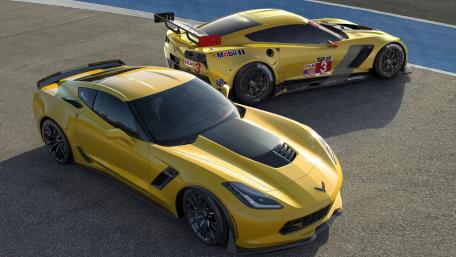 Sleek Performance of Yellow Sports Cars in Action wallpaper