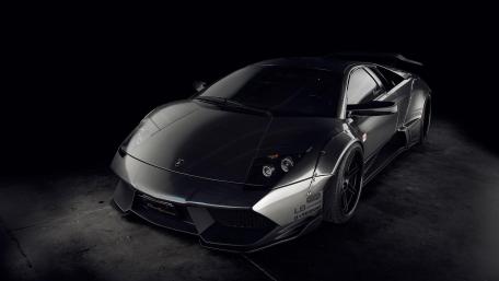 Sleek and Powerful Supercar in Dark Setting wallpaper