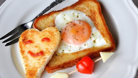 Cheerful Breakfast with Heart-Shaped Toast and Egg wallpaper