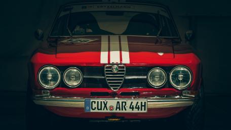 Classic Red Alfa Romeo with Racing Stripes wallpaper