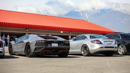 Sleek Supercars Under the Open Sky wallpaper