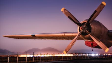 Vintage Propeller Aircraft in Twilight Scene wallpaper