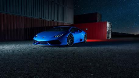 Sleek Blue Lamborghini Under Starry Sky wallpaper