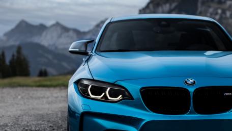 Sleek Blue BMW in Scenic Landscape wallpaper