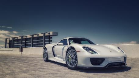 Sleek White Supercar in Urban Setting wallpaper