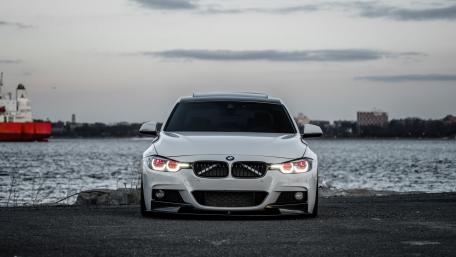 Sleek BMW at Waterfront Elegance wallpaper