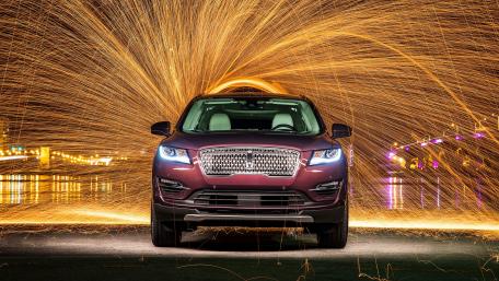 Dynamic Car with Sparkling Light Display for Enthusiasts wallpaper