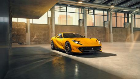 Stunning Yellow Sports Car in Urban Setting wallpaper