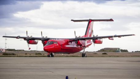 Bold Red Aircraft on the Tarmac wallpaper