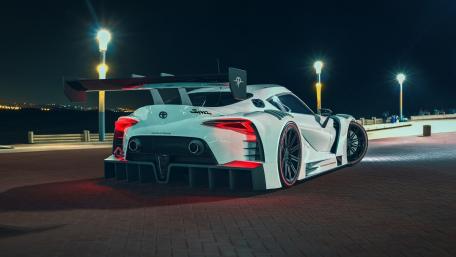 Sleek Nighttime Supra on the Waterfront wallpaper