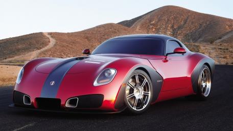 Sleek Red Sportscar on an Open Road wallpaper