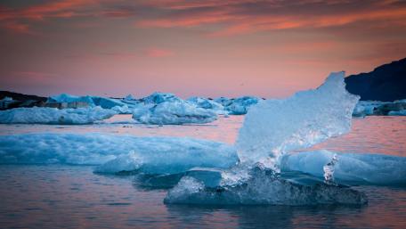 Serene Icebergs Under a Colorful Sky wallpaper