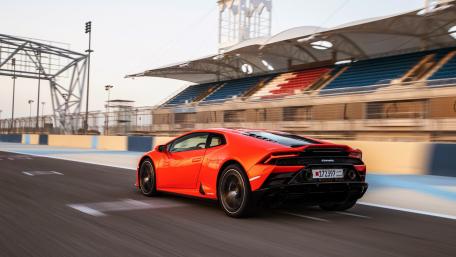 Sleek Red Sports Car on the Racetrack wallpaper