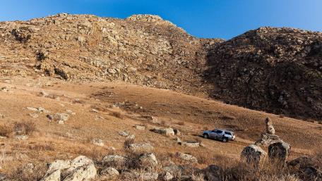 Serene Mountain Landscape with Vehicle Adventure wallpaper