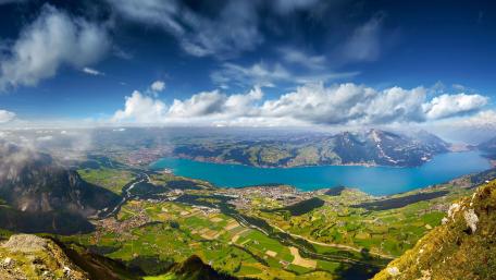 Breathtaking Aerial View of Serene Lake and Mountains wallpaper