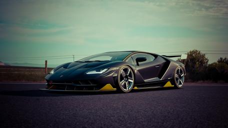 Sleek and Powerful Supercar on Open Road wallpaper