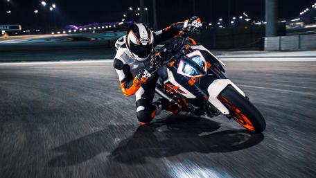 Dynamic Night Ride of a KTM Motorbike Racer wallpaper
