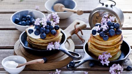 Delicious Blueberry Pancakes with Floral Touches wallpaper
