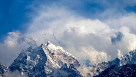 Majestic Peaks Wrapped in Clouds wallpaper