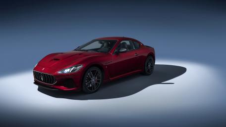 Sleek Red Sports Car on Display wallpaper