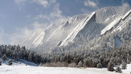 Majestic Snow-Capped Mountains Against a Clear Sky wallpaper