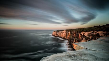 Serene Coastal Cliffs at Dusk wallpaper