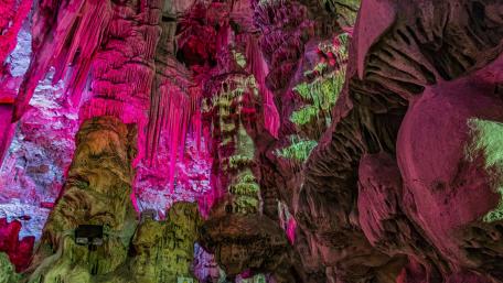Stunning Cave with Colorful Stalactites and Shadows wallpaper