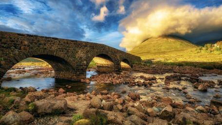 Majestic Bridge Surrounded by Nature's Beauty wallpaper