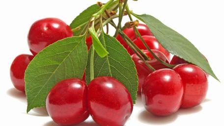 Vibrant Red Cherries Displayed Naturally wallpaper